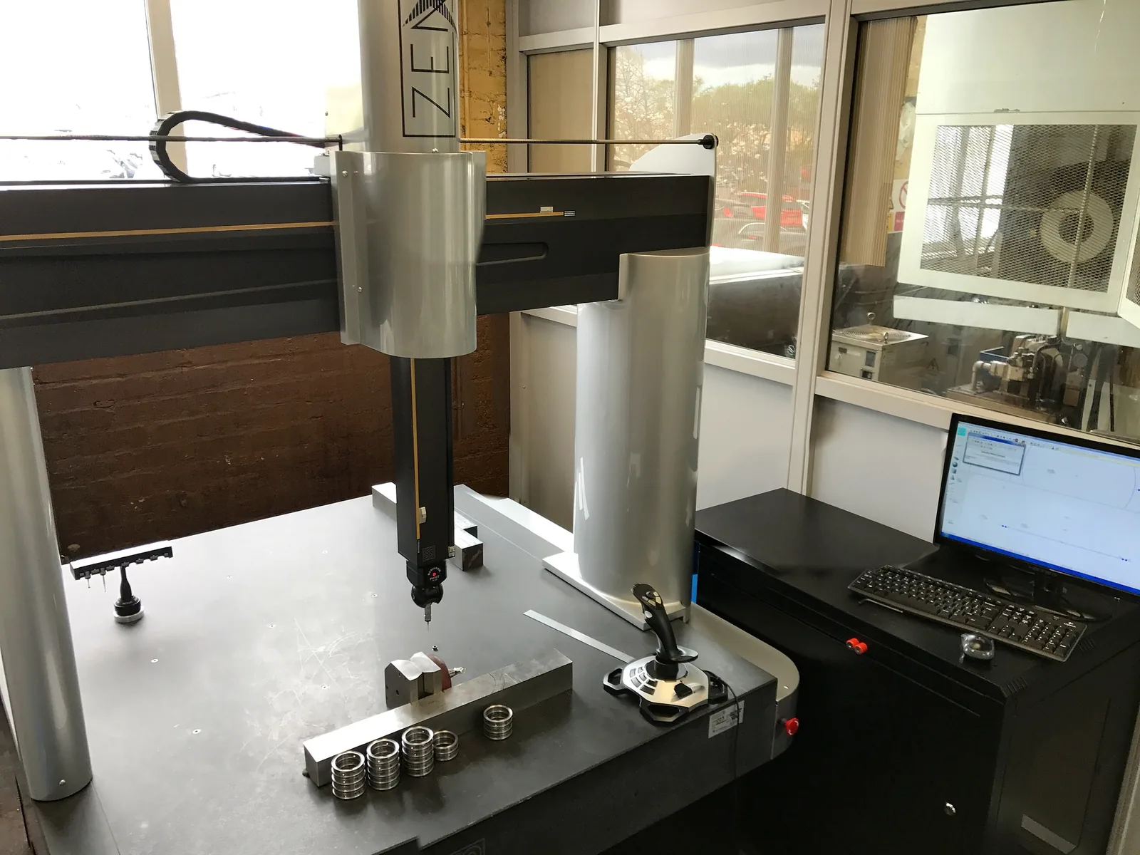 The coordinate measuring machine in the inspection area