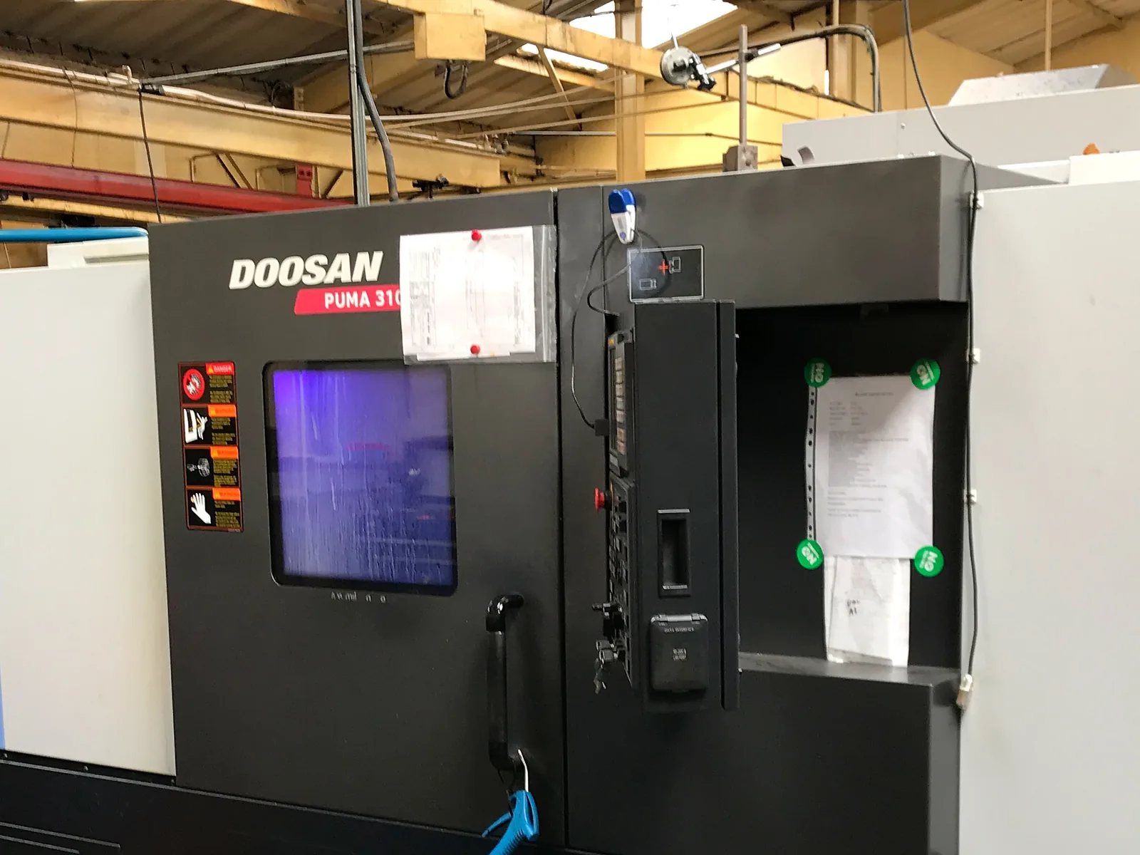 The front of a Doosan Puma 3100 CNC turning centre in the workshop
